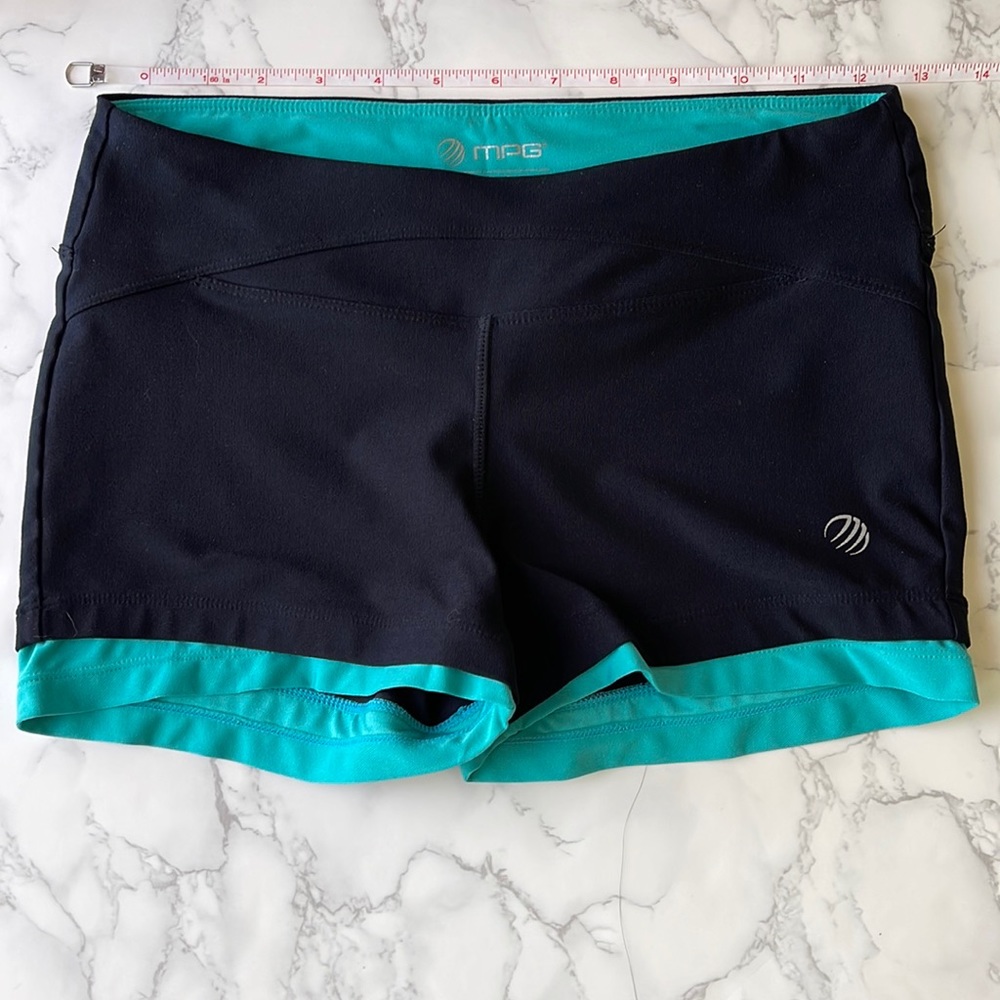 Black workout shorts with teal trim